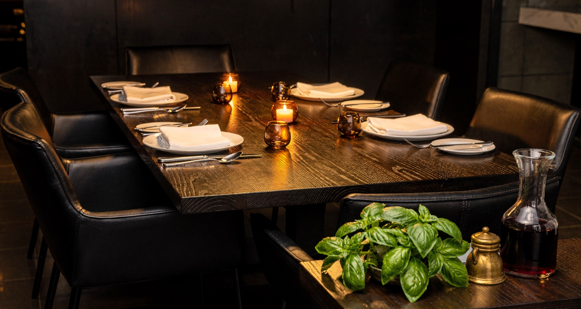 Guests savoring dessert flights at a long dark wooden table